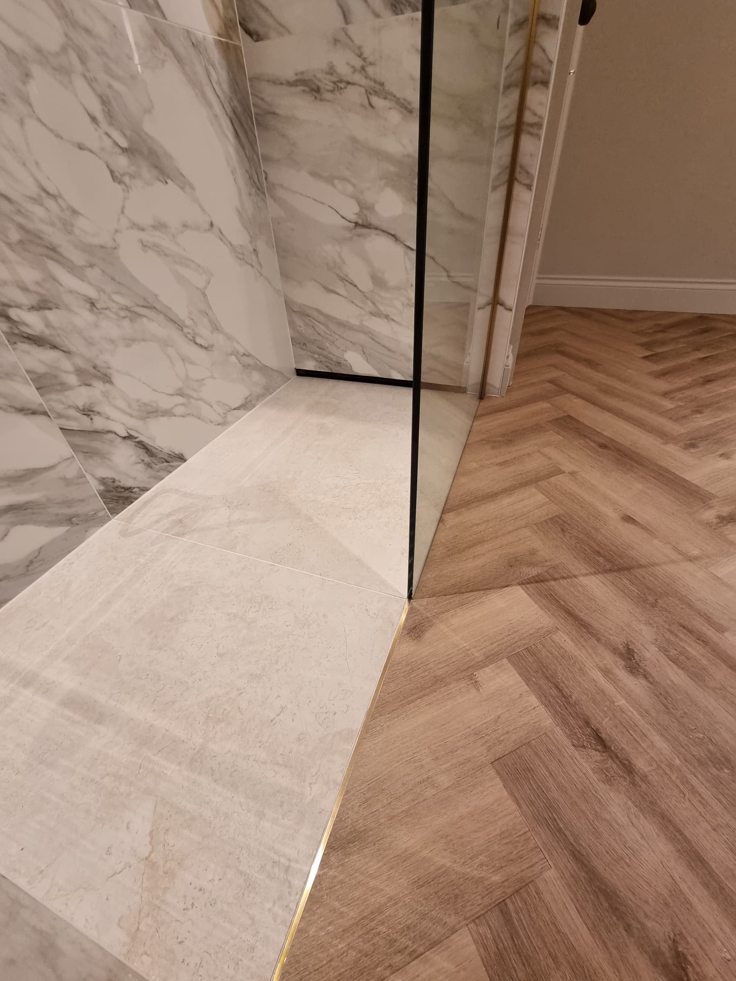 Detail of flush materials with undermounted brass strips