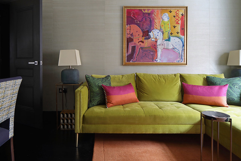 Living room with Grasscloth wall covering, velvet sofa, original art