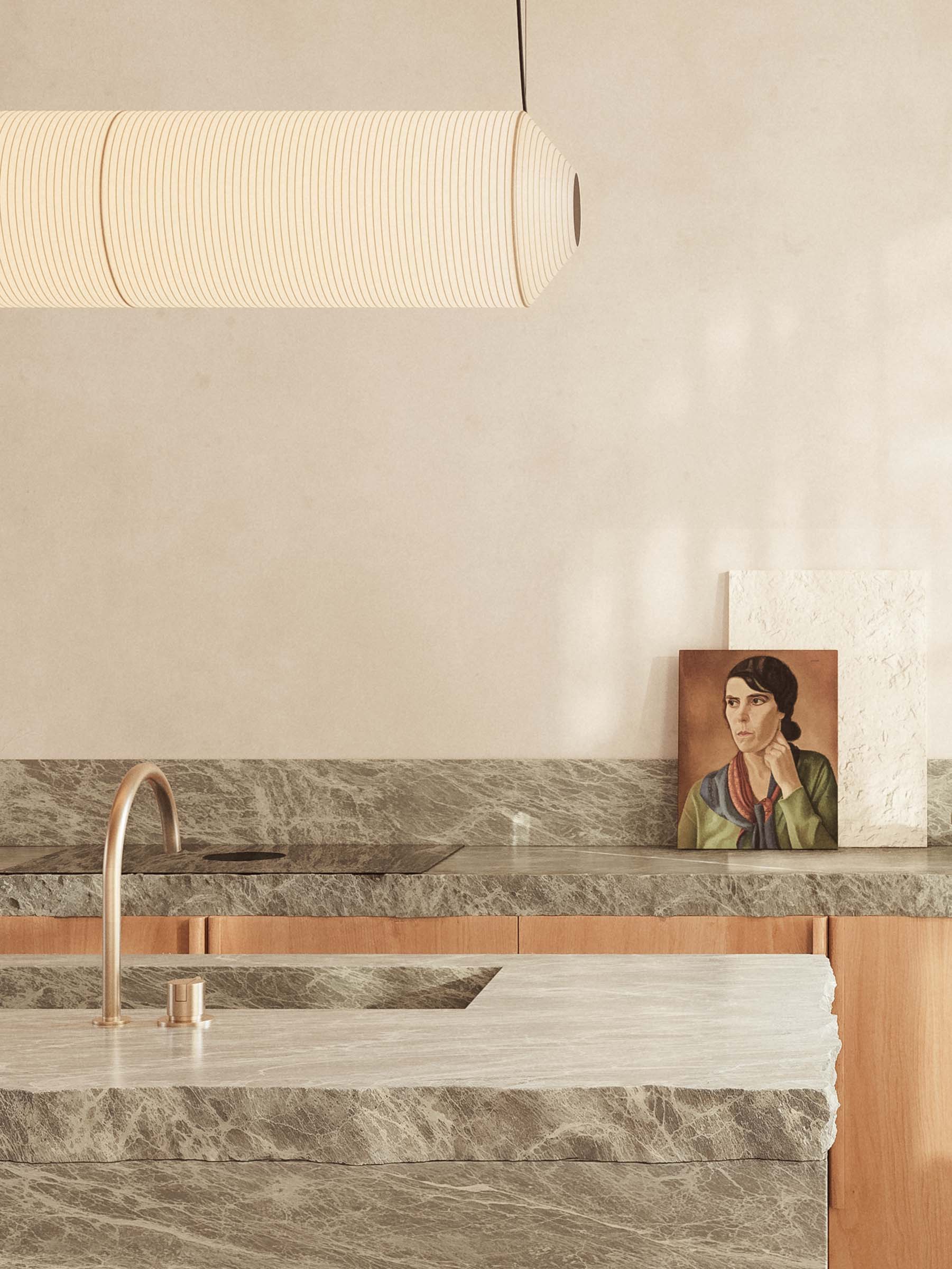 Belsize Park house extension kitchen design in stone and oak with pendant light