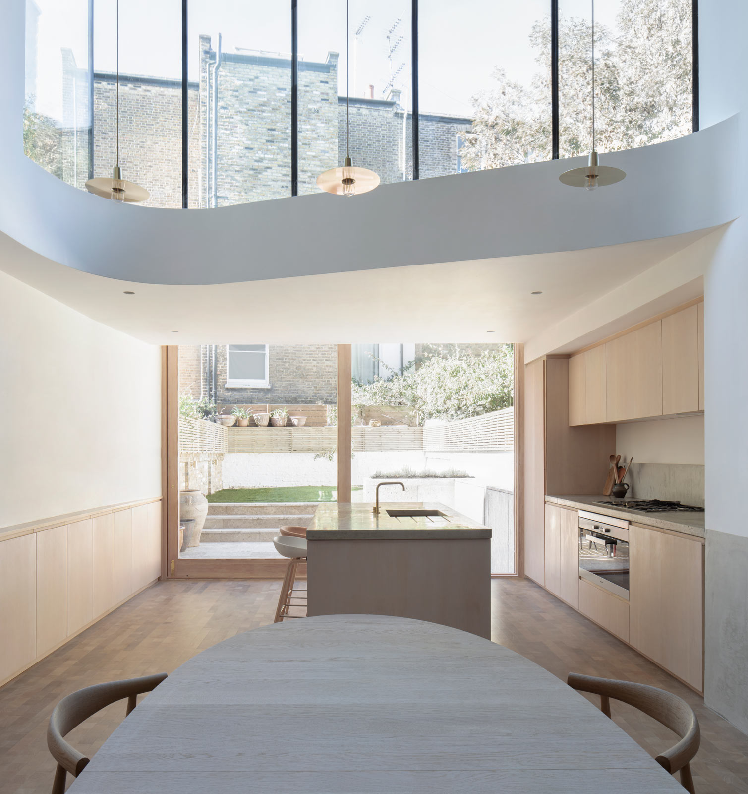 Architect designed double storey glass rear extension in Brook Green