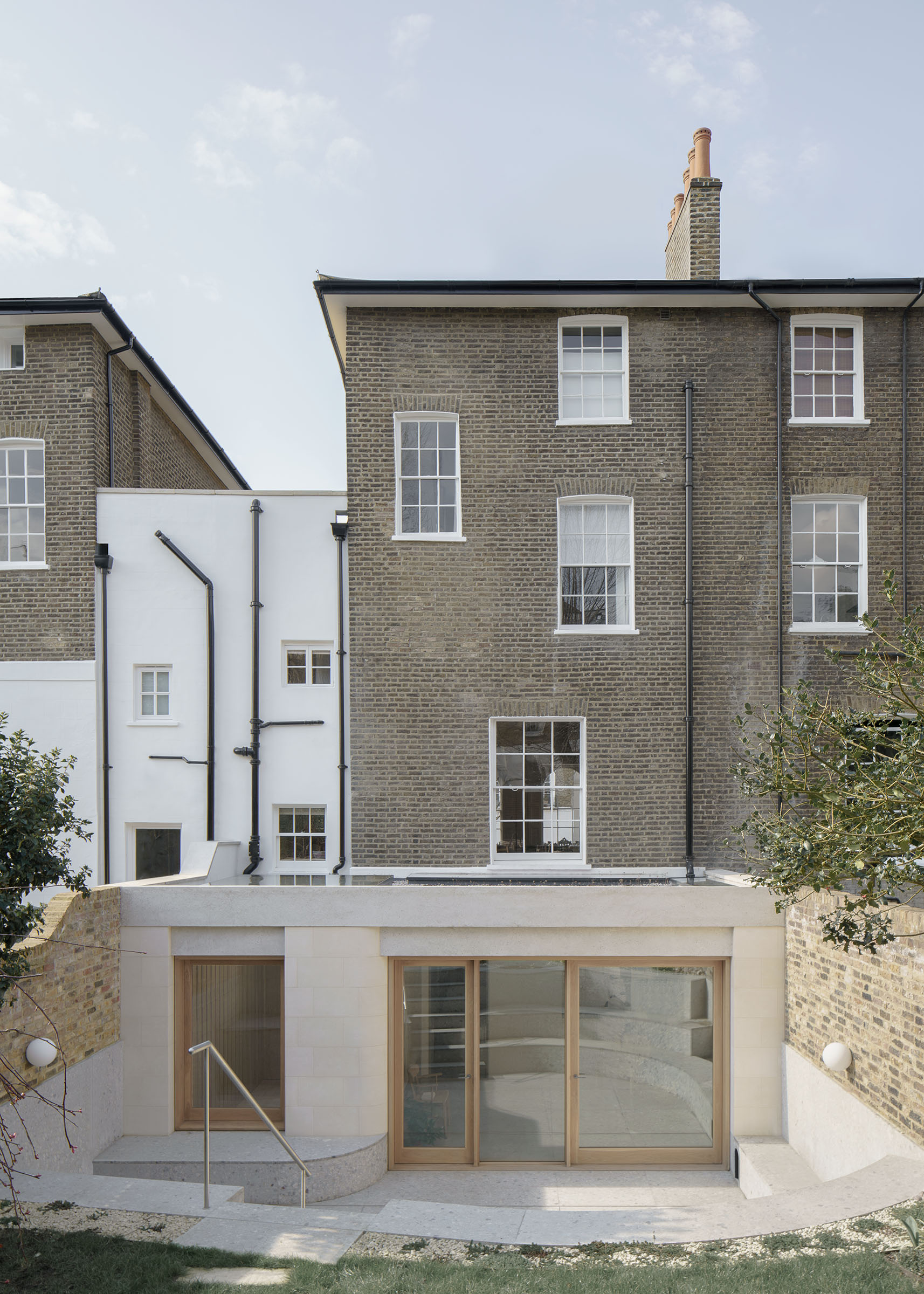 Architect designed house extension in Islington in stone and oak
