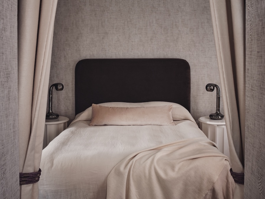 Primary bedroom with Pierre Frey wallpaper, soothing colour palette, and cosy furnishings
