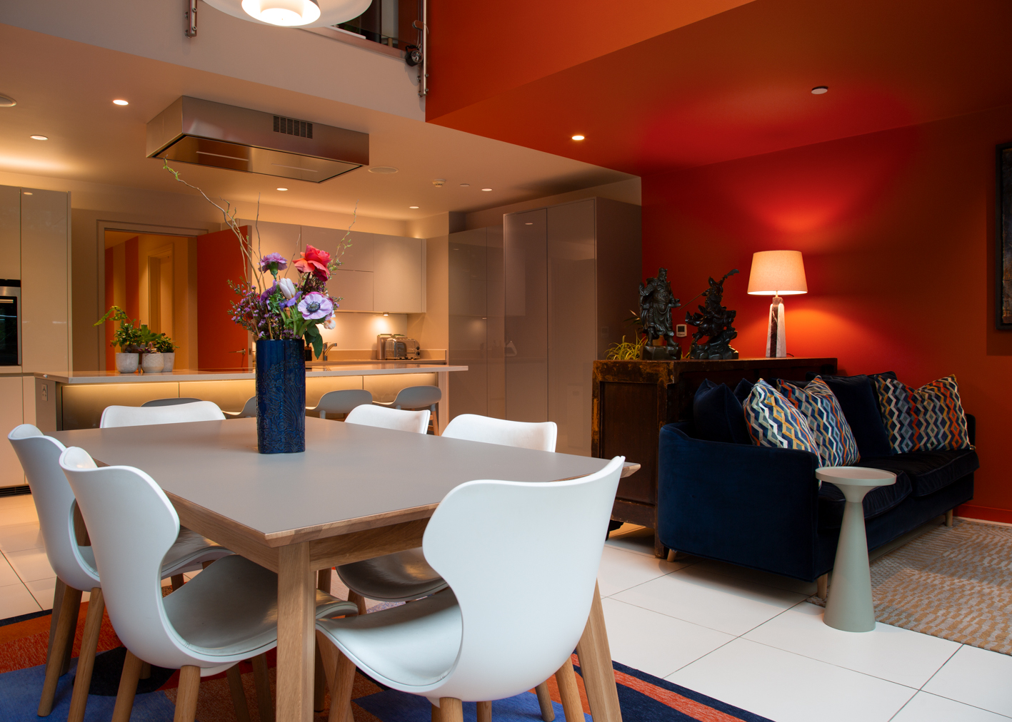 A vew acorss the dining table to the kitchen