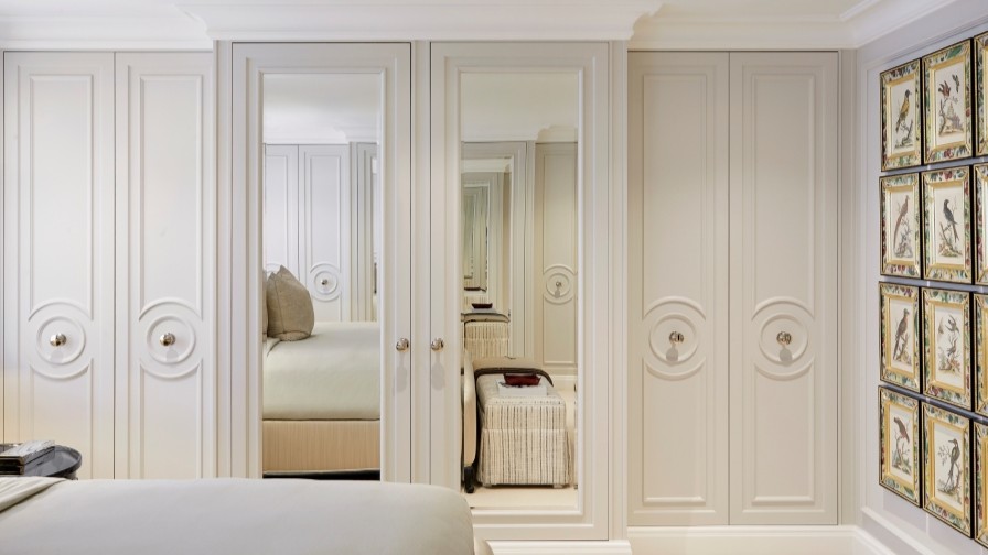 Invisible slot detailing within master suite joinery providing invisible air conditioning