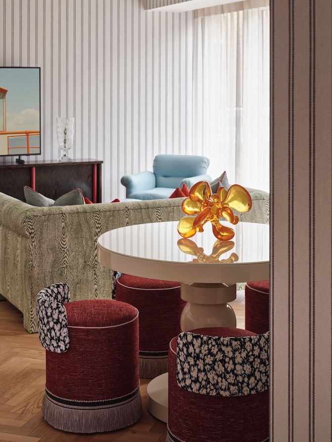 Dining area with Studio L designed dining table, and custom petite stools