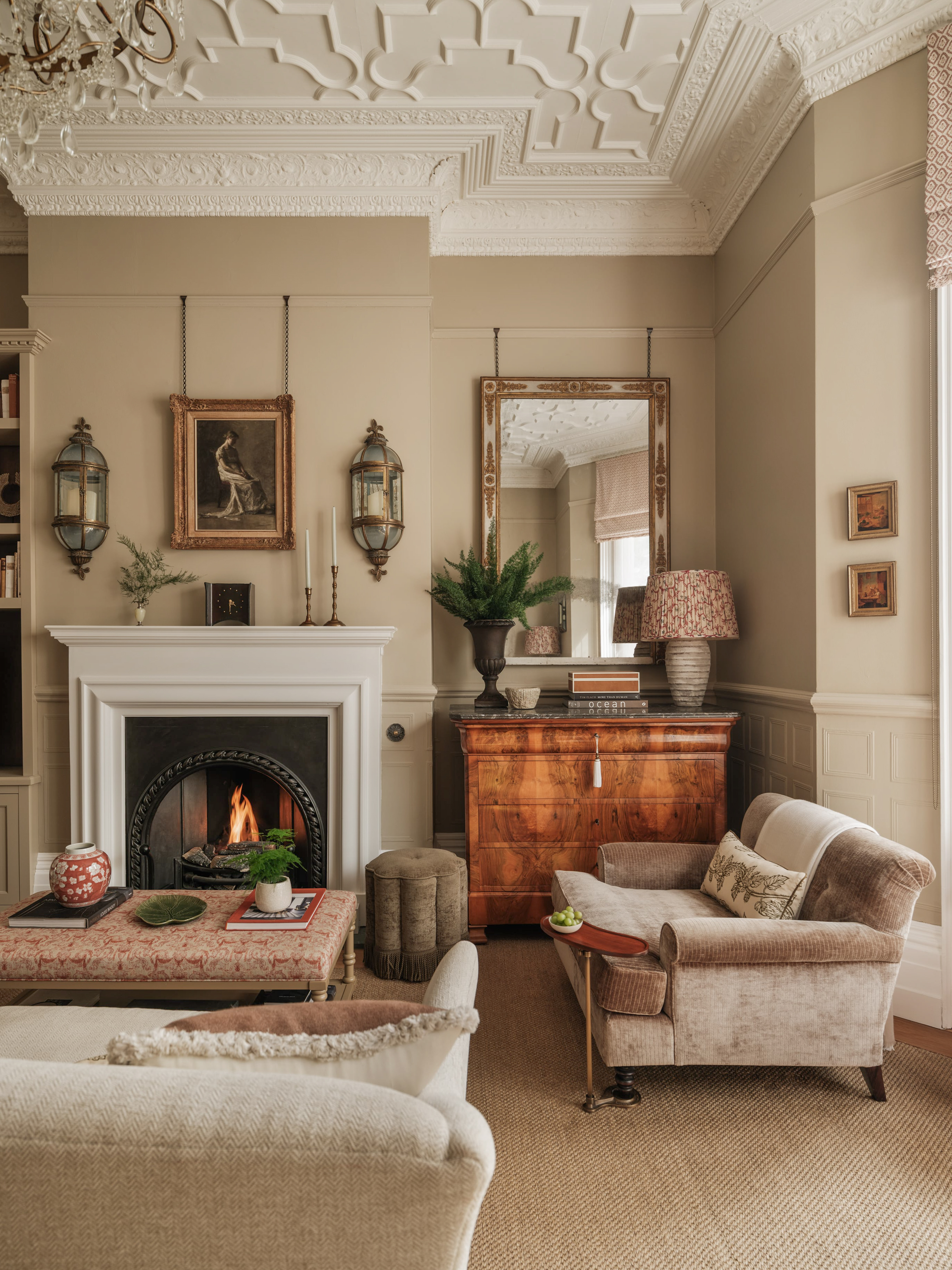 Antiques in a sussex victorian living room with original ceiling 