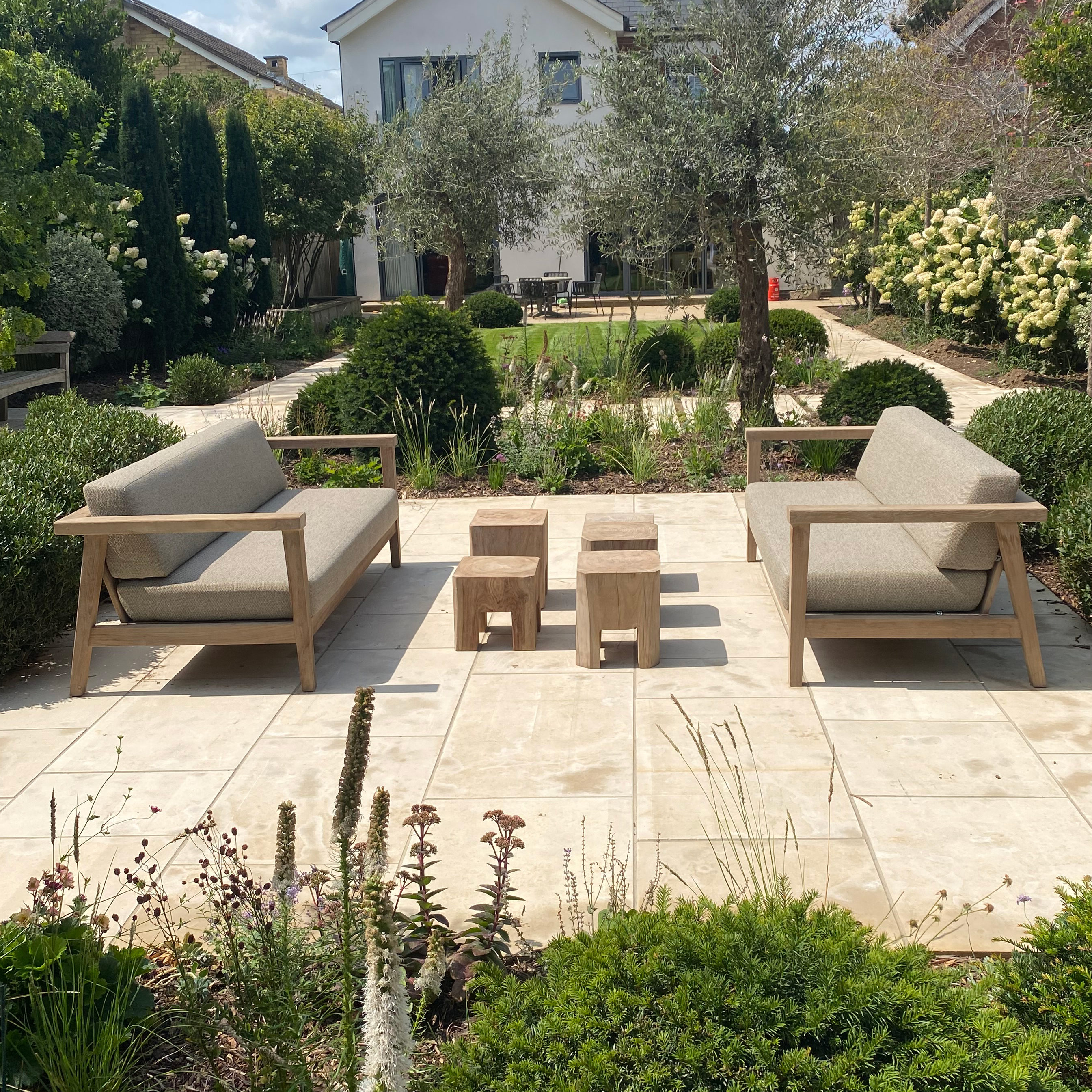 Image of Gommaire Copenhague lounge furniture in sunny sheltered coastal garden