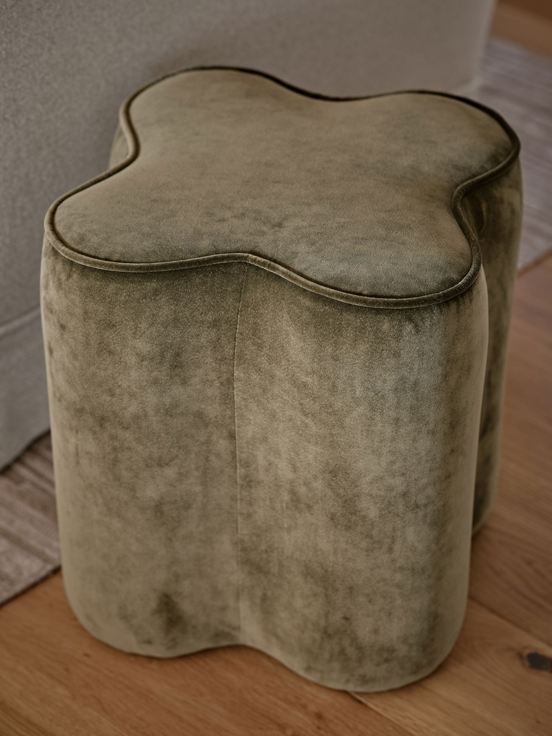 A sage green clover shape pouffe bespoke made by Origins Design