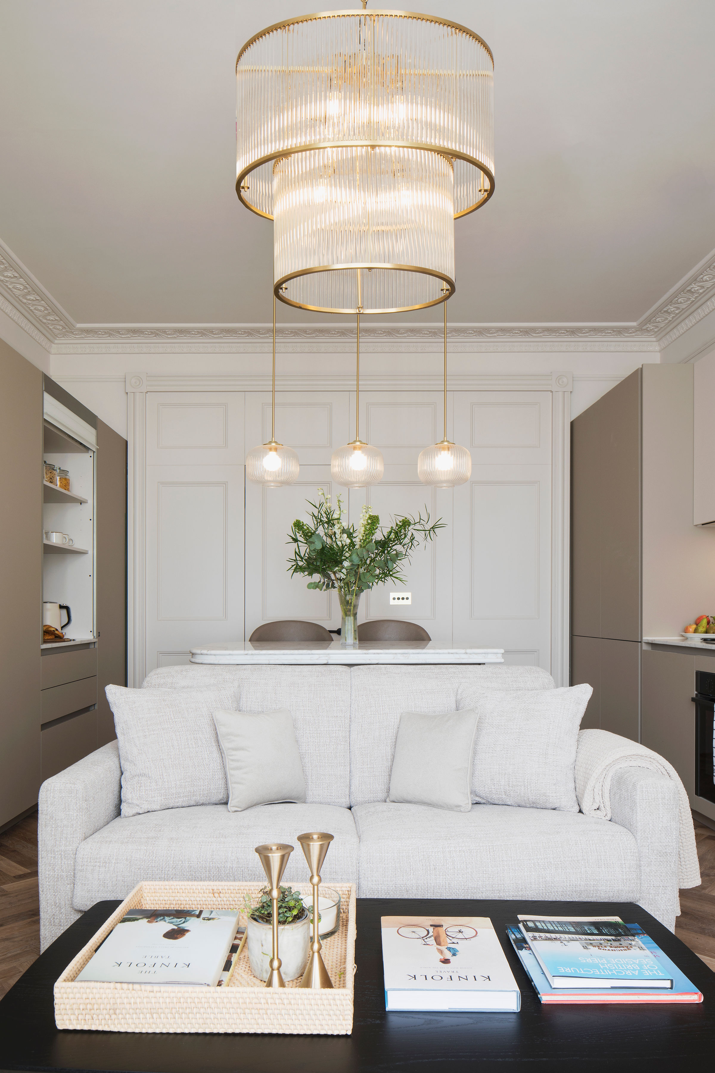 Regency apartment living room with bespoke kitchen, period panelling and statement lighting at 29 Regency Square, Brighton