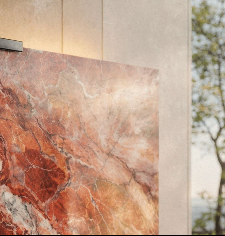 Close-up of Rouge des Carpates marble Halo Screen with rich red veining, polished surface, and matte-black top clamp in natural light