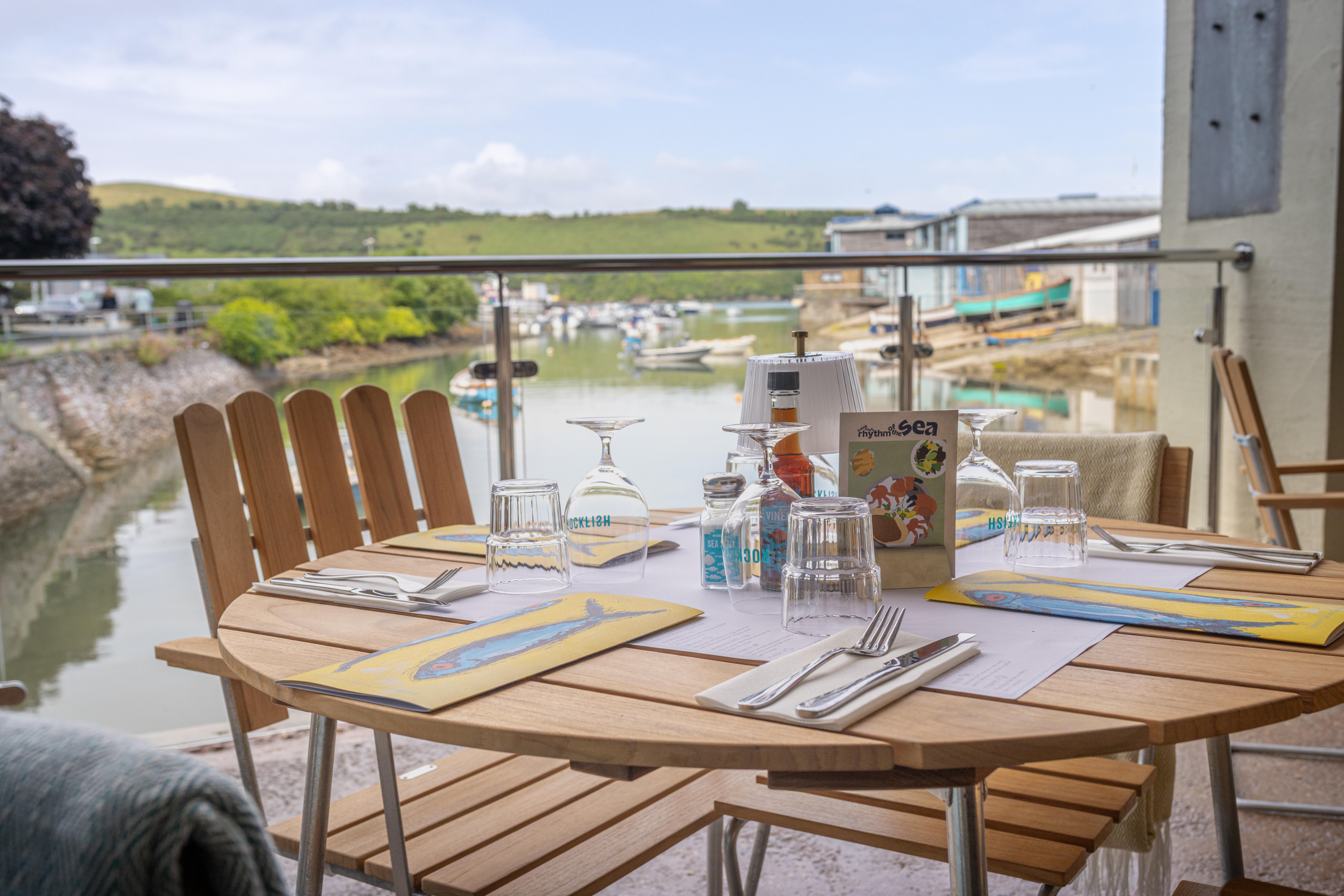 Image of Grythyttan Stahlmobler furniture in FSC teak and galvanised steel at Rockfish Restaurant, specified by Day Studio