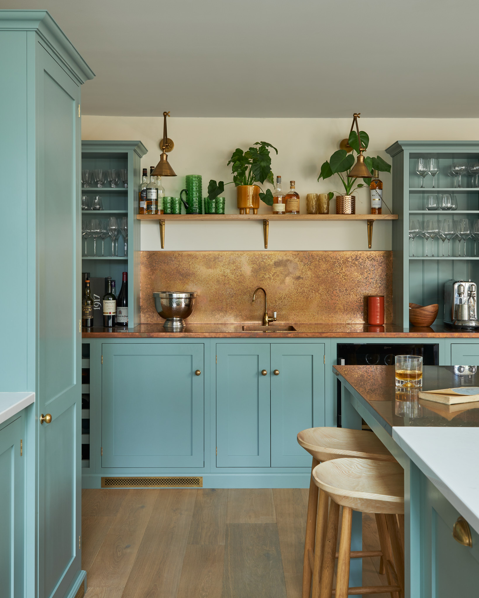 Blue Devol kitchen with copper splash back