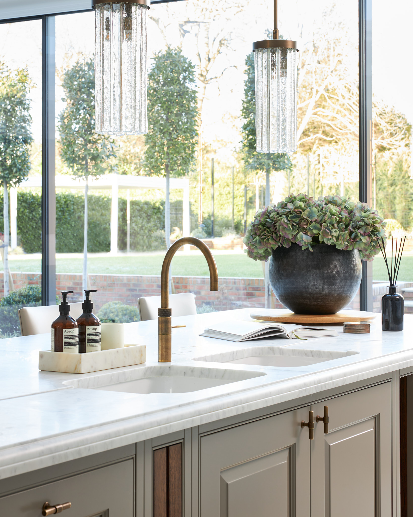shaker kitchen island with contemporary glass and garden connection