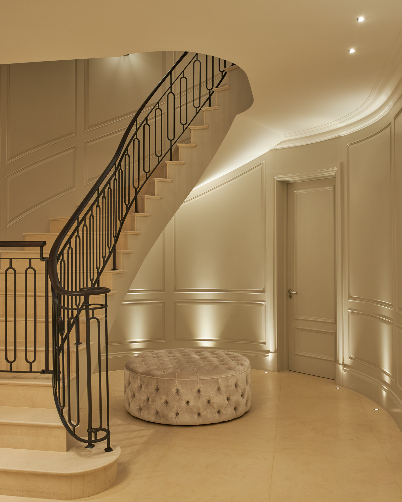 metal work handrail stone clad staircase and curved panelled stair and hallway