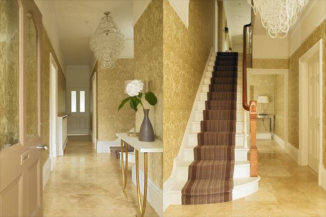 Travertine floors and underfloor heating continue into adjacent rooms, with lighting & understated colours creating an open, welcoming feel