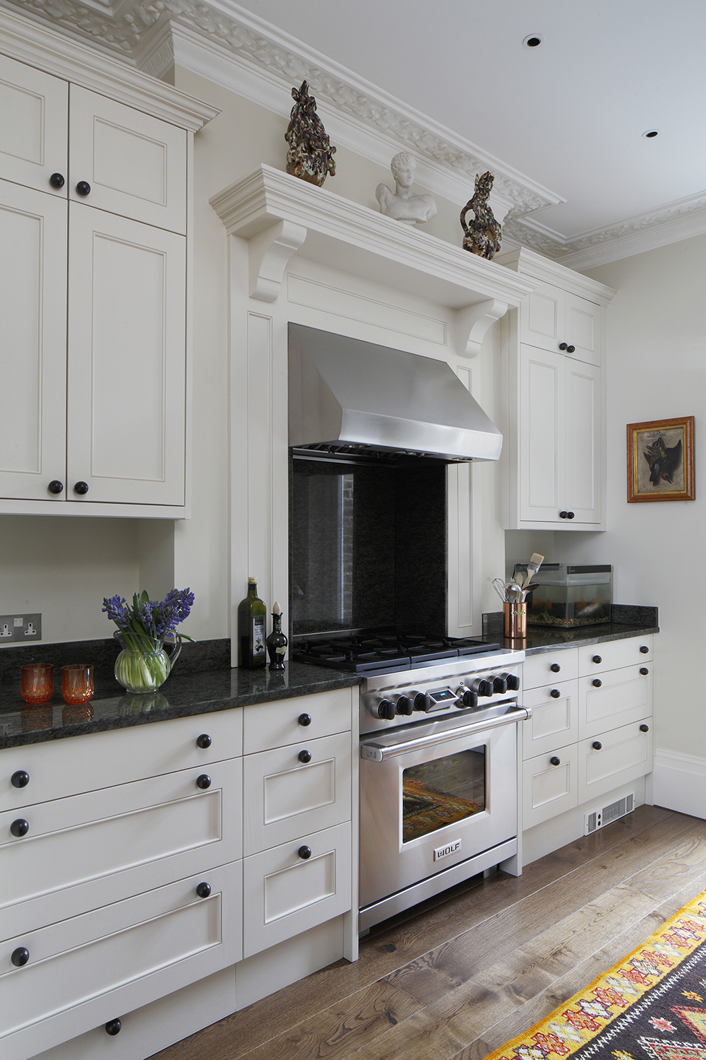 Custom built joinery with a stylish mottled black and mustard granite worktop.