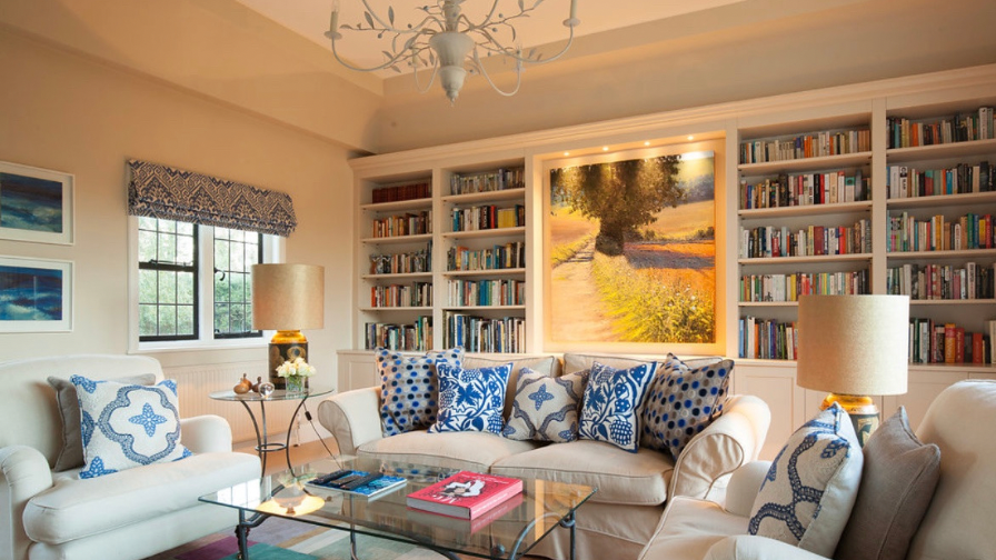 Osborne & Little cushions , oka sofas, bookcase joinery , artwork displayed joinery , hampshire interior design