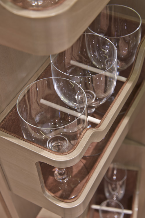 Suede lined shelves for crystal glasses.