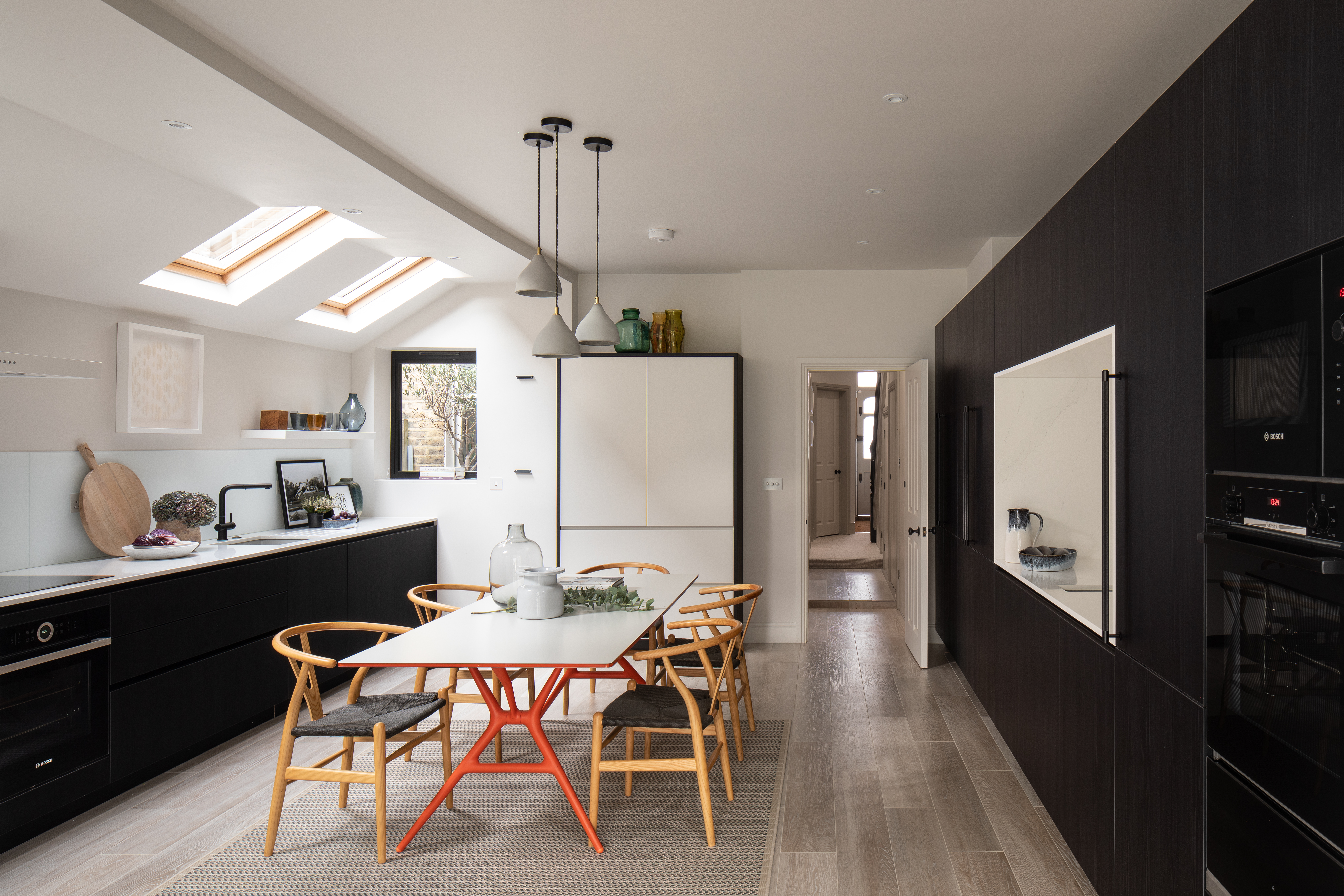 Contemporary kitchen, monochrome palette, handle free kitchen, composite worktop, quooker tap, pantry cupboard