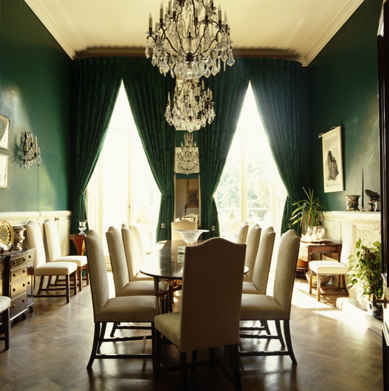Emerald green walls, silk curtains with white panelling and white velvet chairs are a scheme associated with the 18th Century.