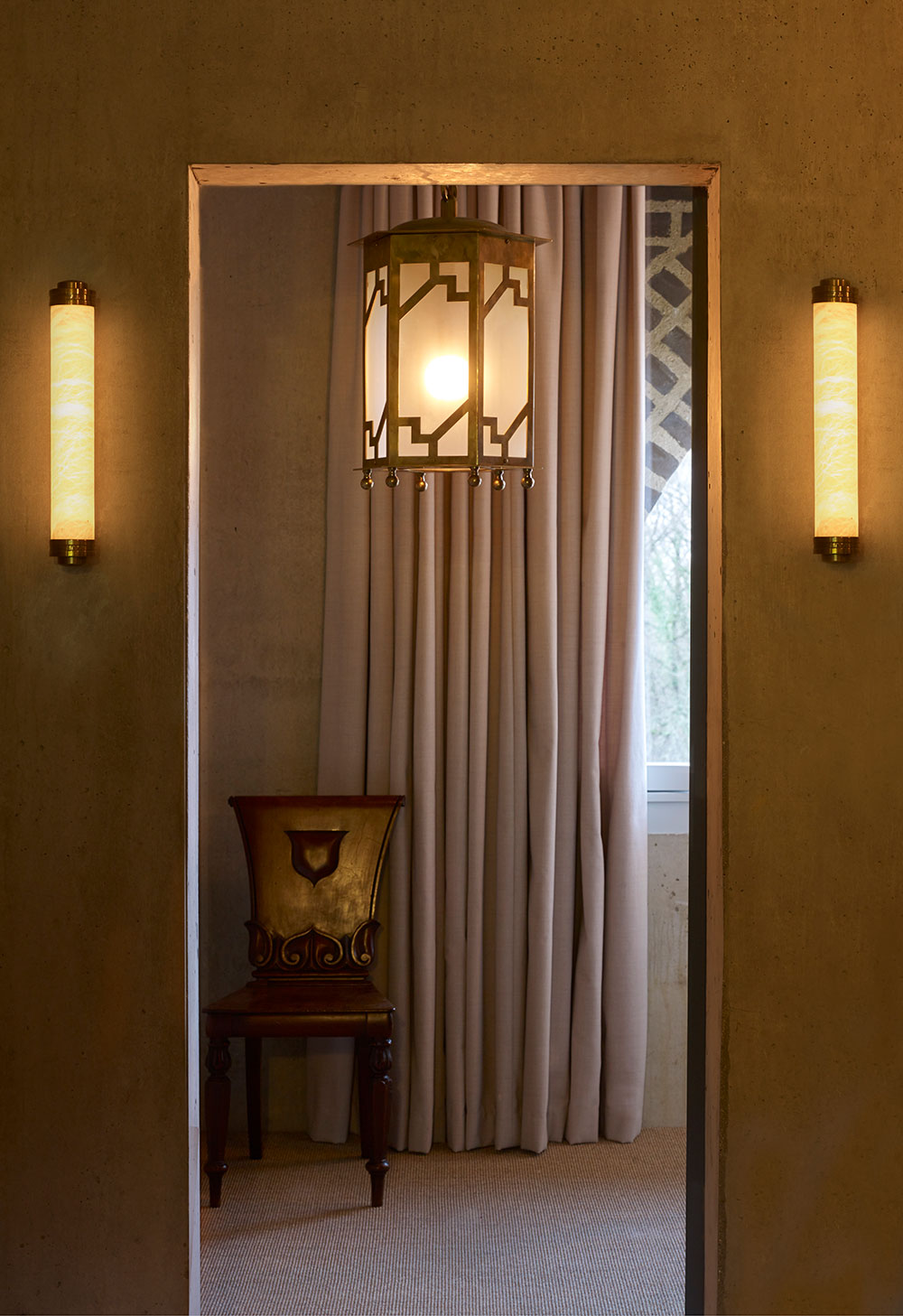 The Steppe Lantern by Collier Webb pictured with two Alabaster wall lights