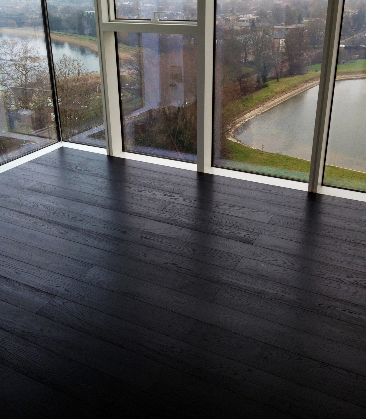 Black Lacquered Brushed Oak Flooring fitted in Penthouse