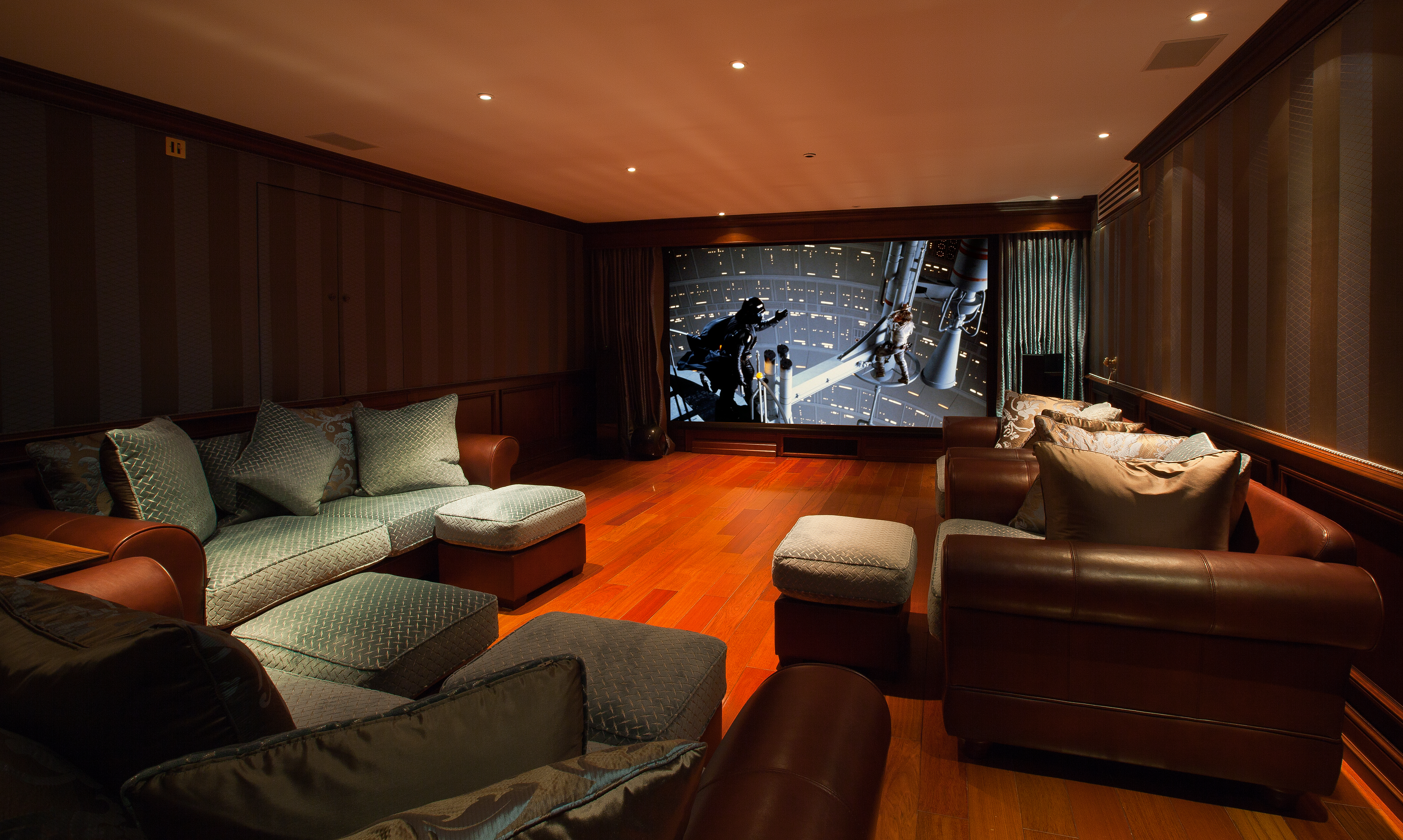 Home cinema, showing large screen with projected image of a Star Wars scene.