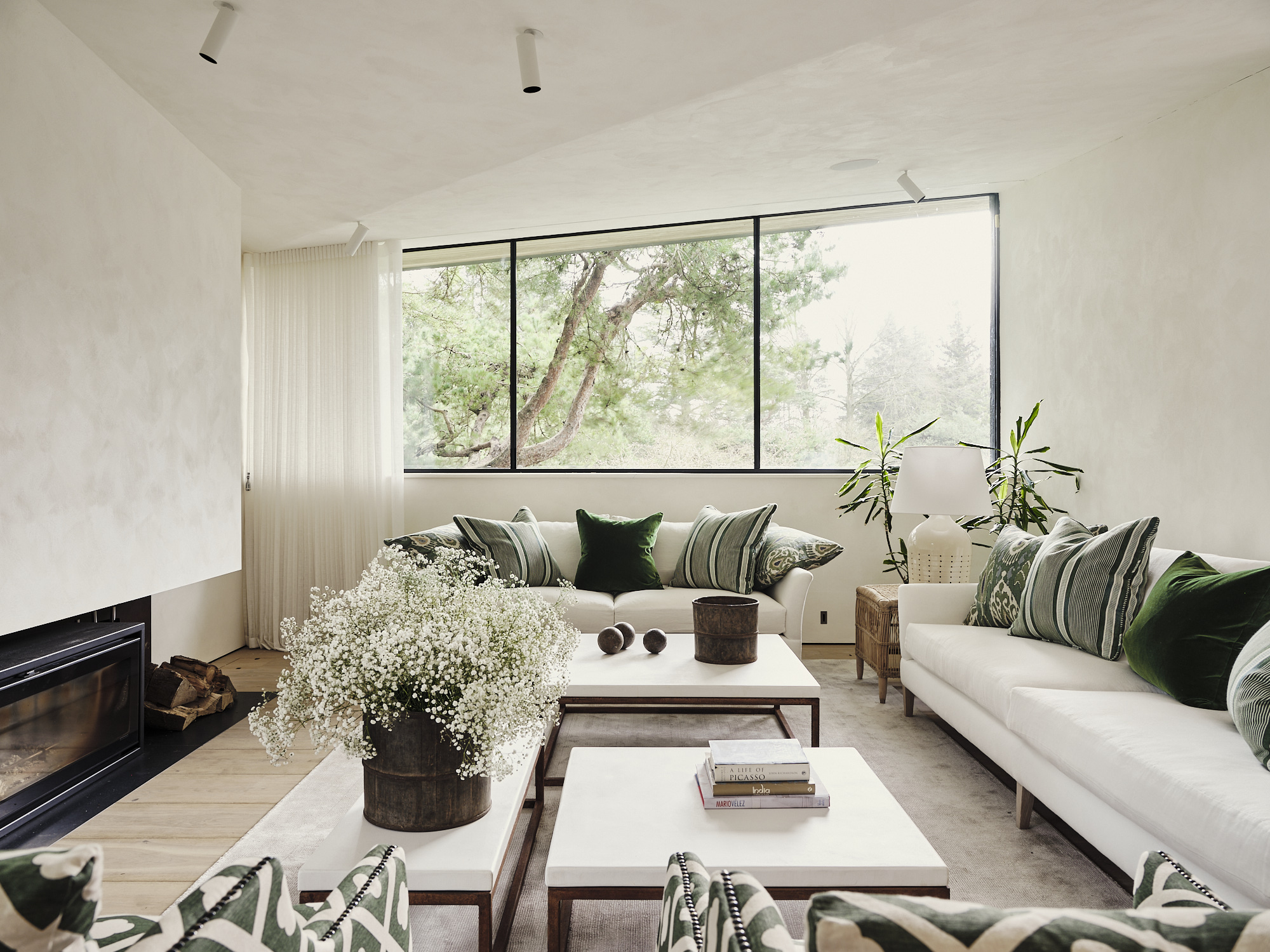 living room white sofas bespoke cushions green cushions bespoke coffee tables polished cement corten table legs fireplace bespoke rug