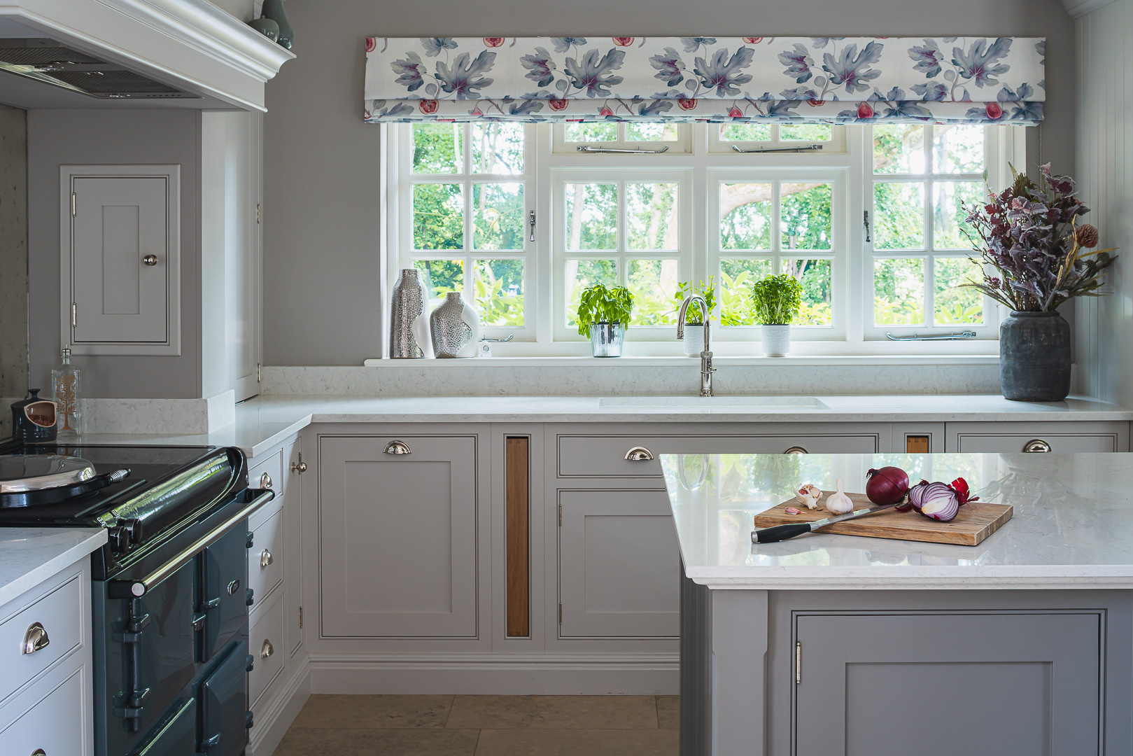 Shaker style Kitchen with Aga in a grey and plum colour scheme.