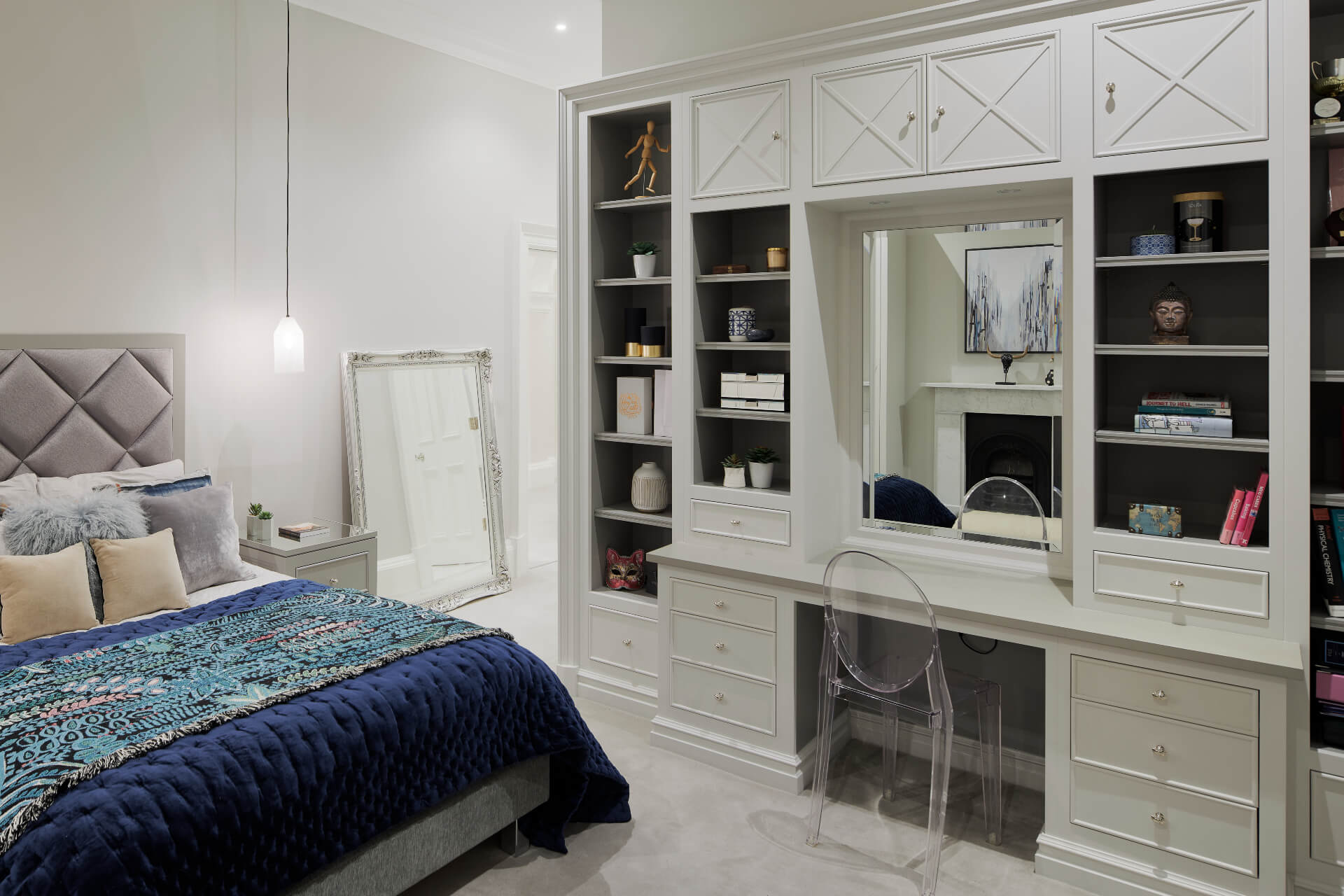 A white painted bedroom unit with dressing table by Hetherington Newman