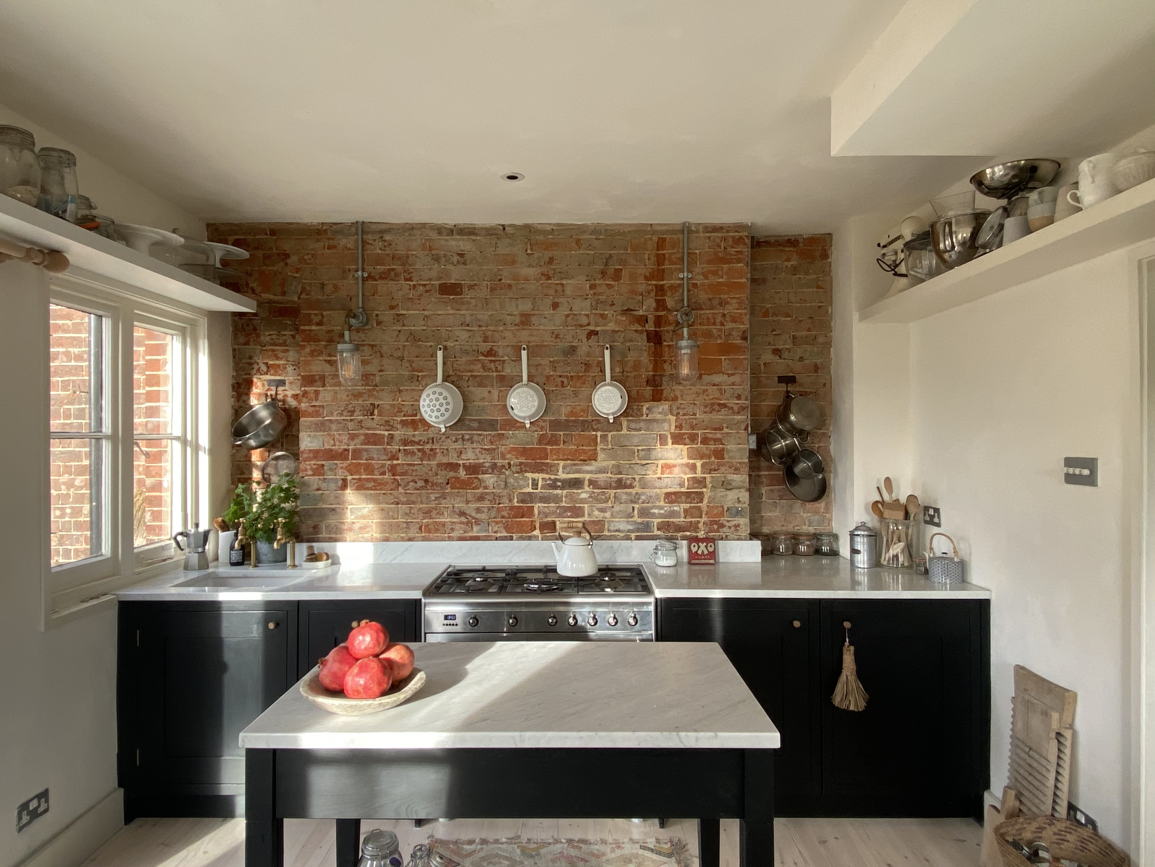 small space living small kitchen marble worktops exposed brick wall