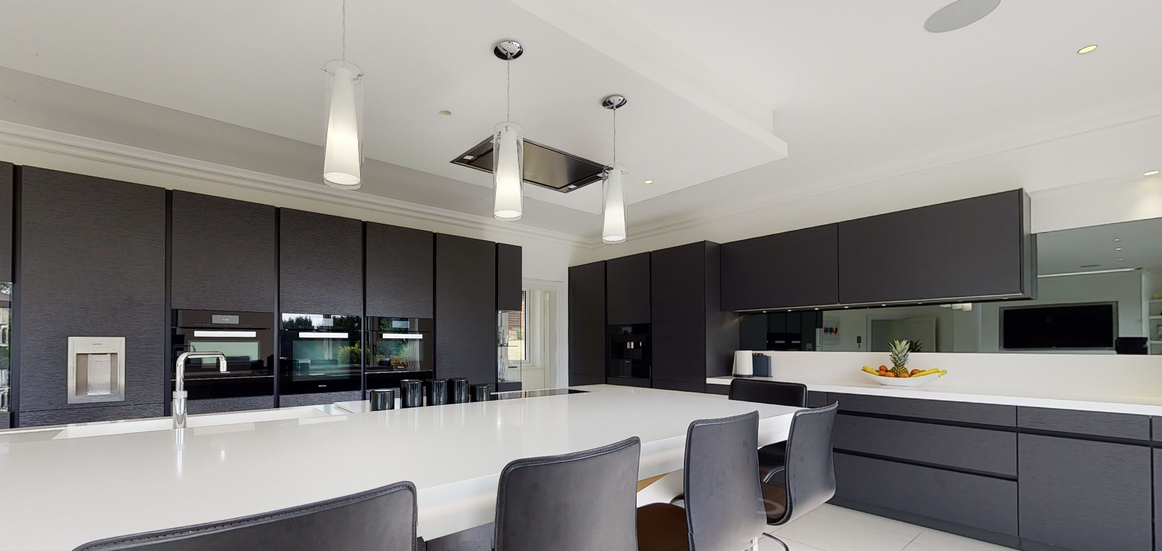 In-ceiling loudspeakers in the kitchen provide the audio.