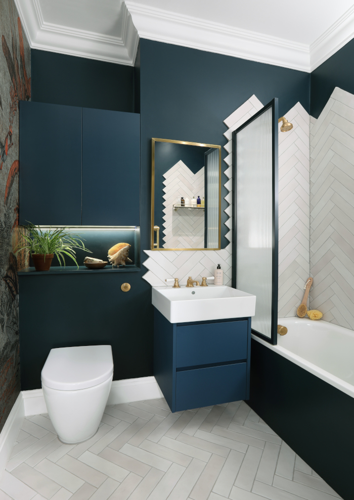 Blue bathroom with brass taps