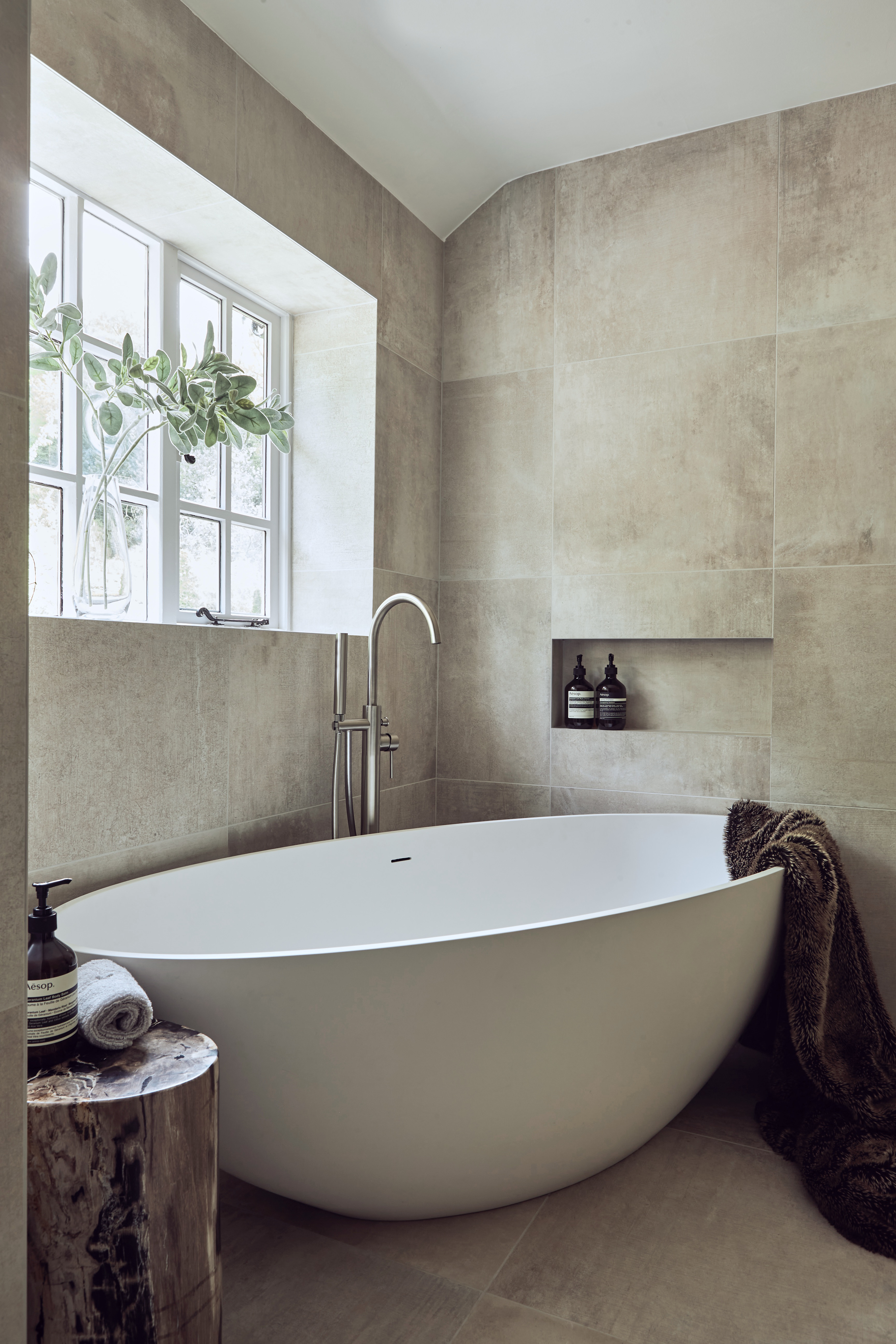  Large freestanding white bath with floorstanding tap