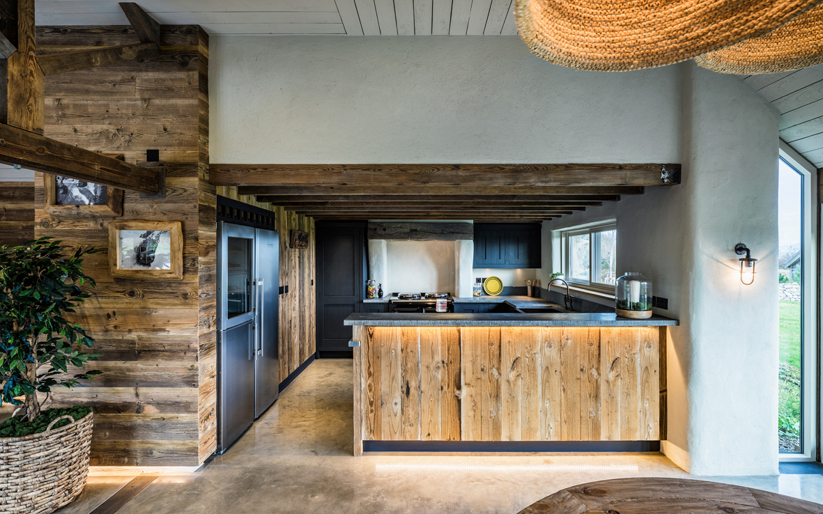 bespoke rustic kitchen designed with polished concrete, timber & lime rendered walls