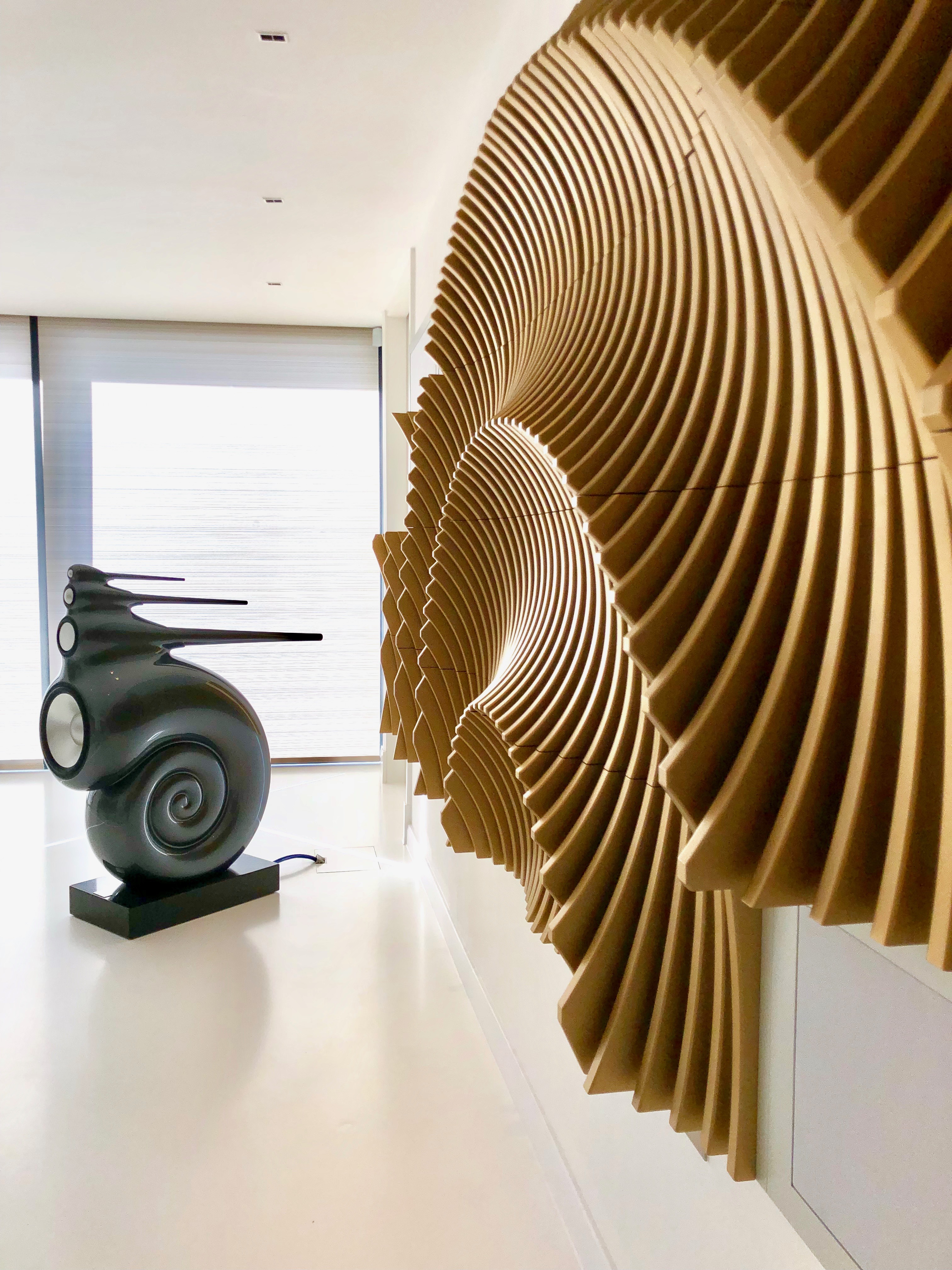 Image shows a loudspeaker with ammonite shaped acoustic treatment.