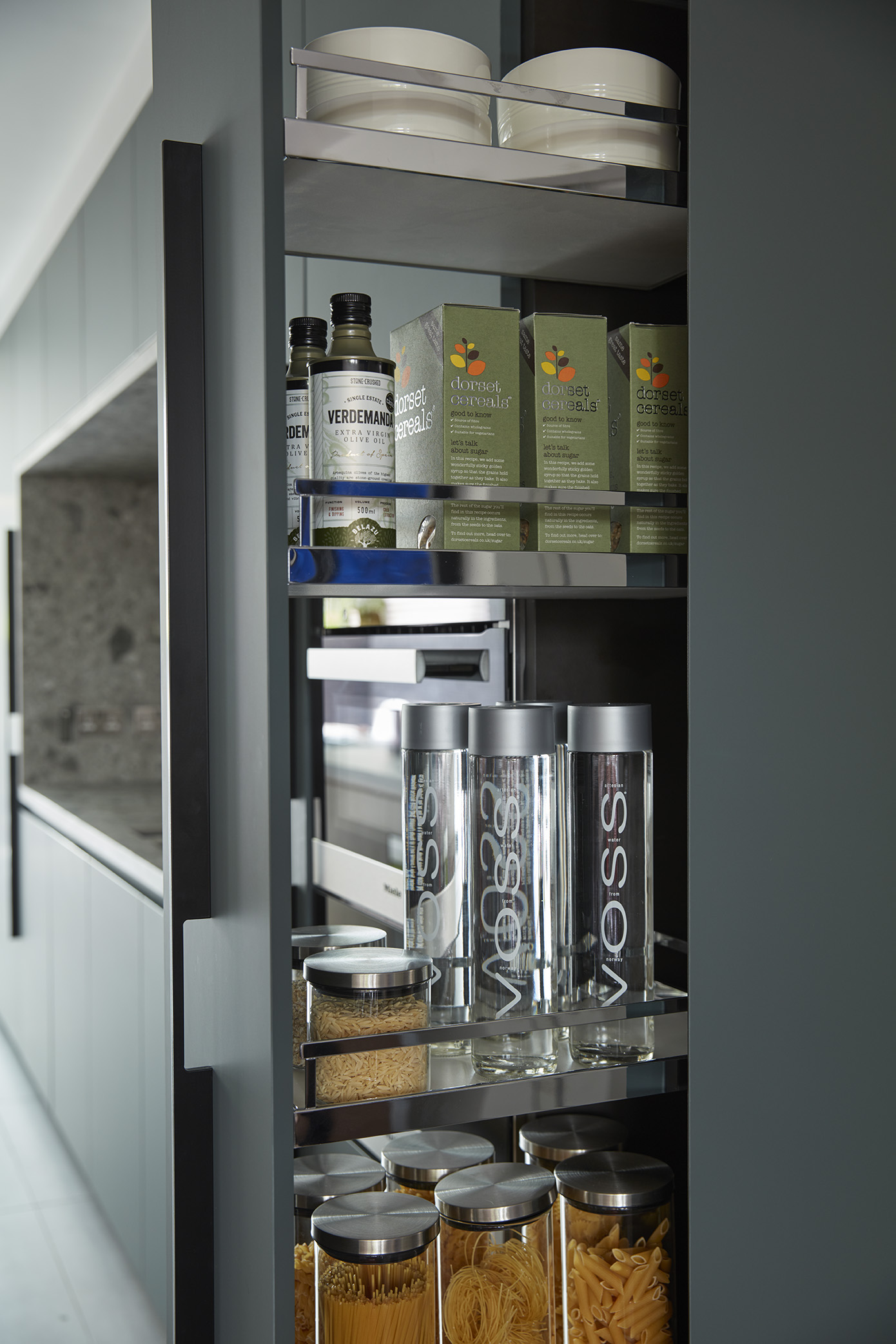 Bespoke kitchen with chestnut veneer and green Fenix cabinetry