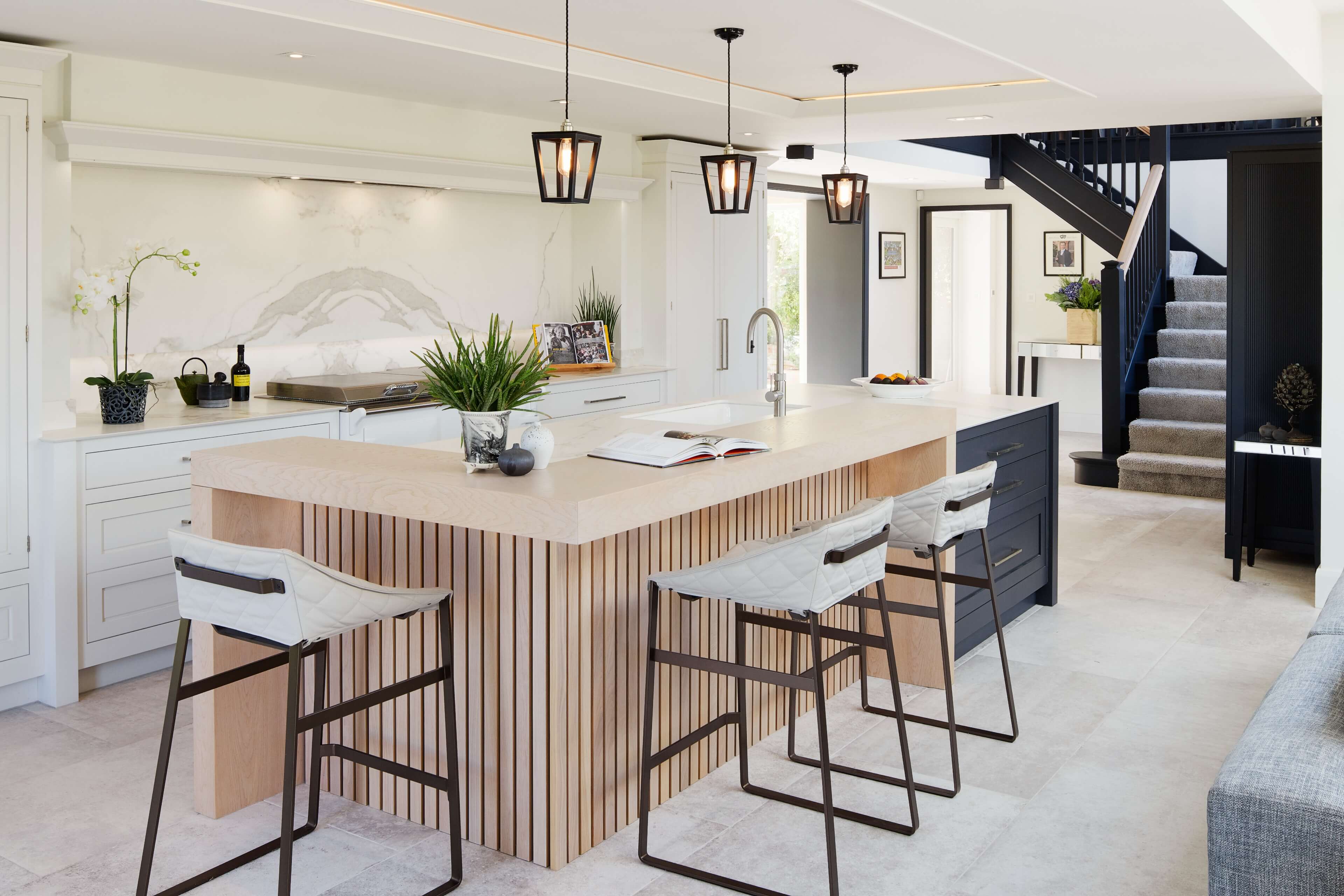 A contemporary style slatted oak fascia to the kitchen island and breakfast bar