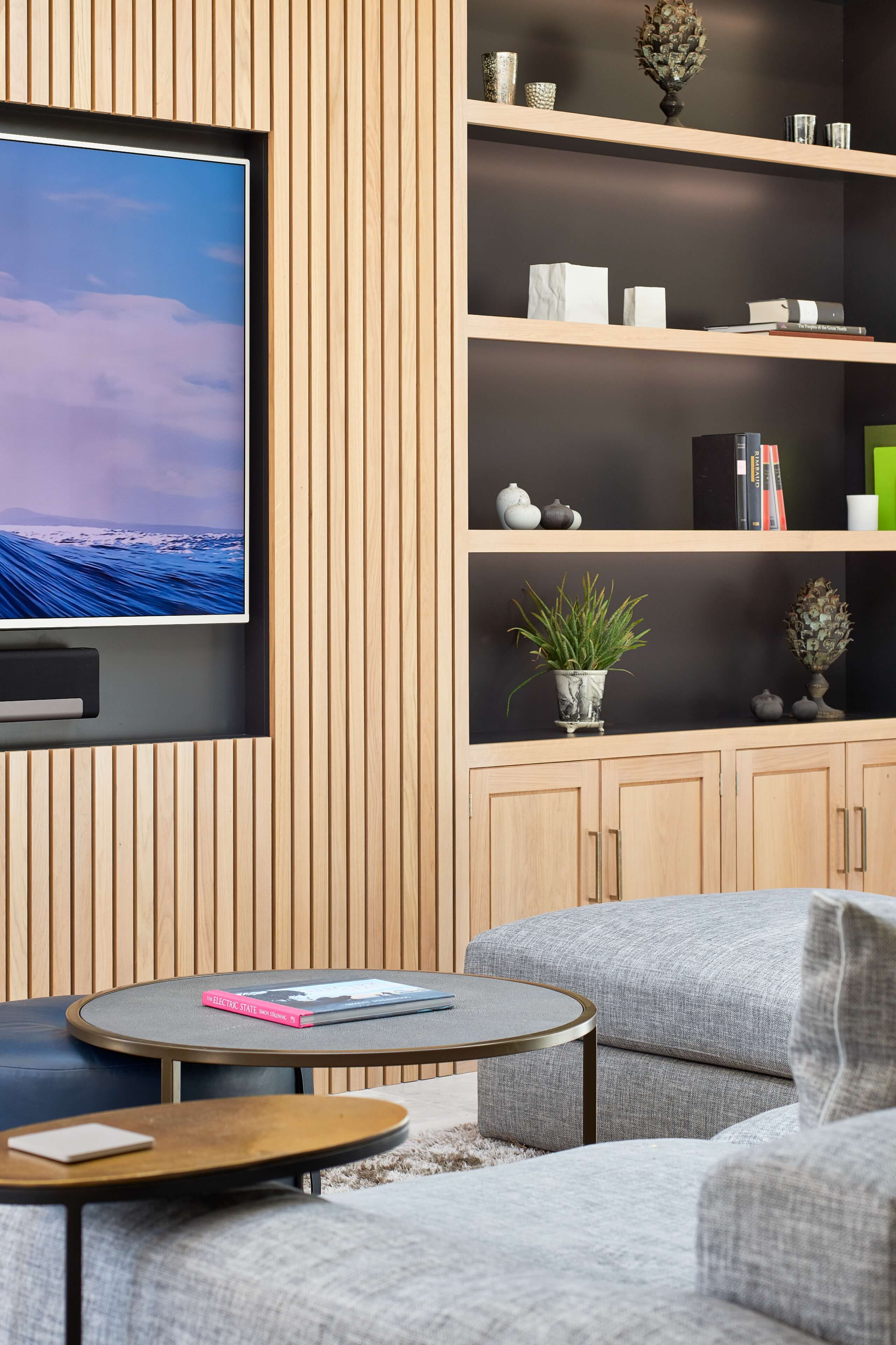 Slatted oak detailing around the wall mounted TV