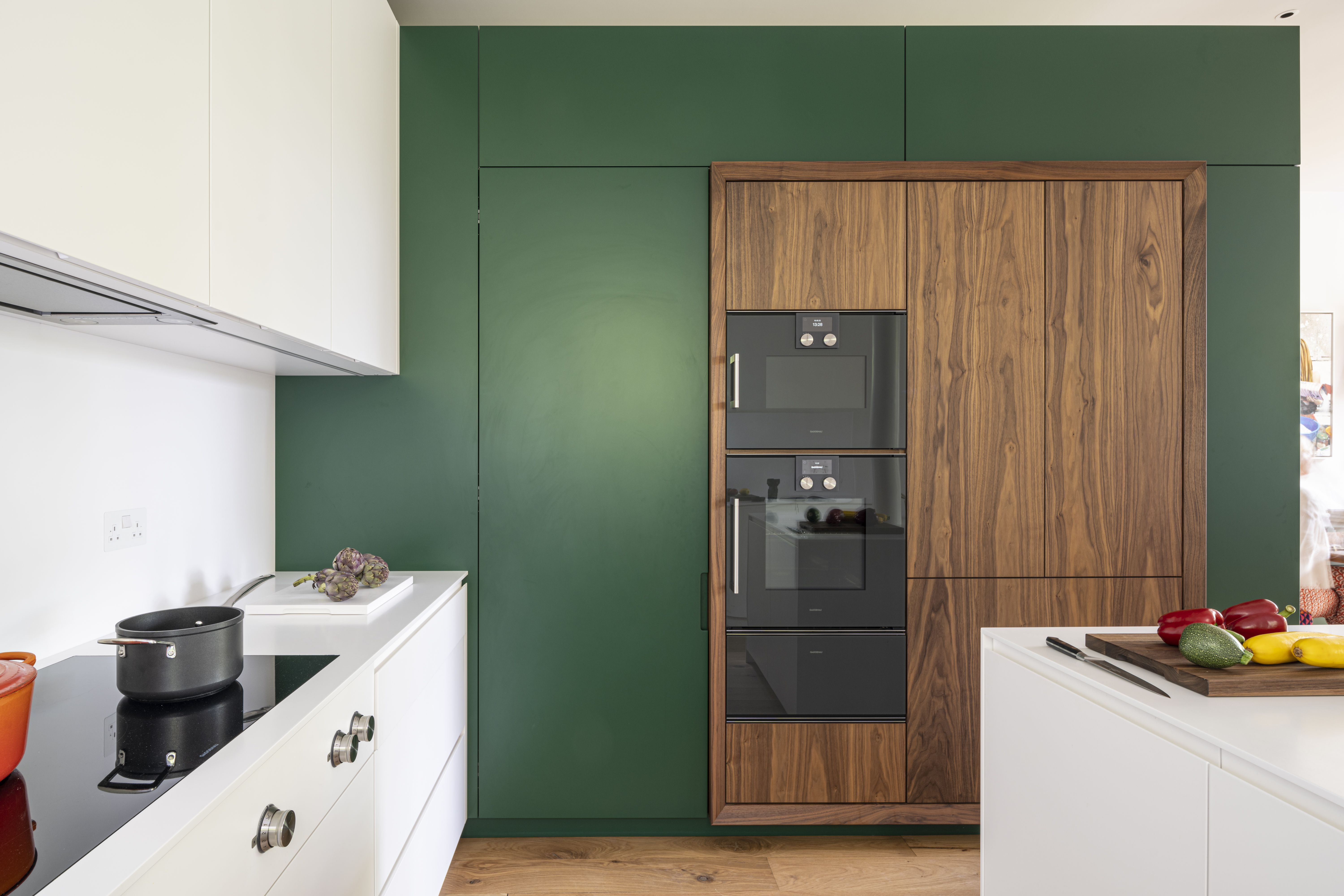 Oven and fridge section with walnut doors and frame