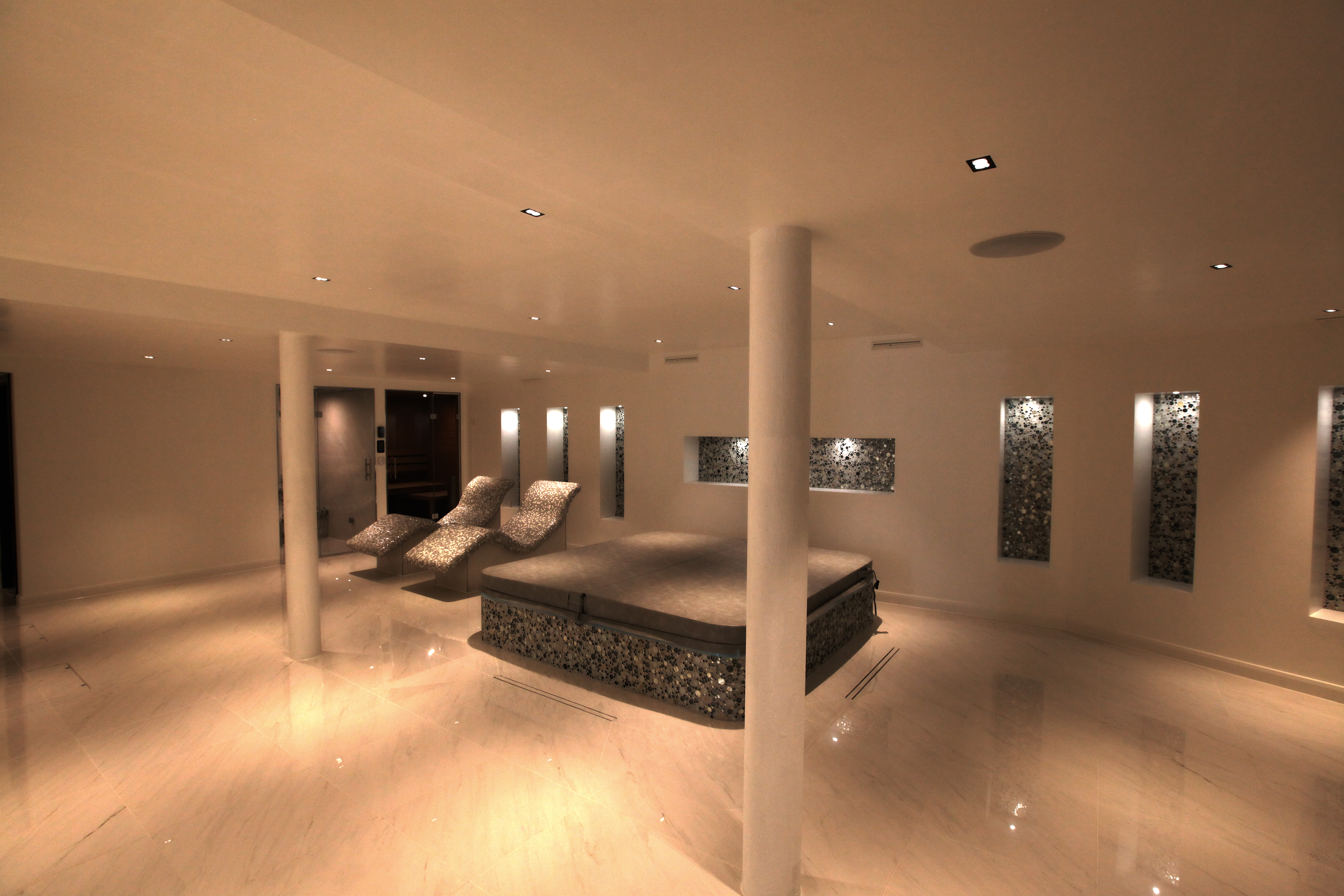 Spa and pool area with in-ceiling speakers and mood lighting.