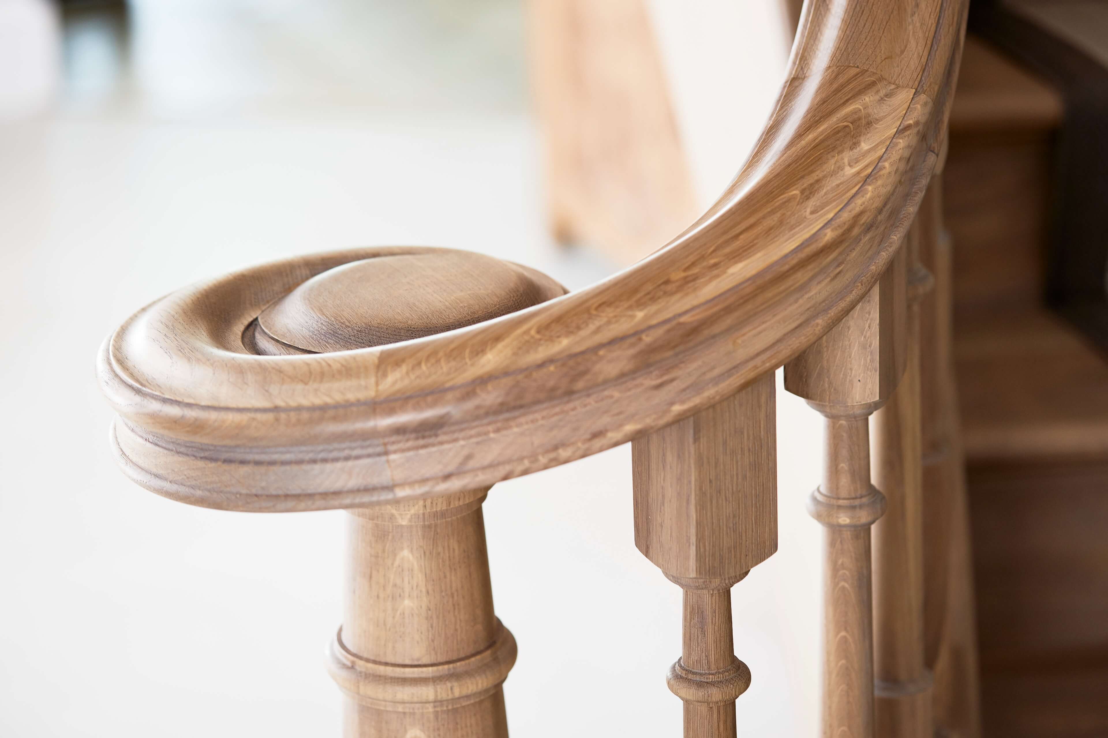 The scroll at the end of the solid oak handrail