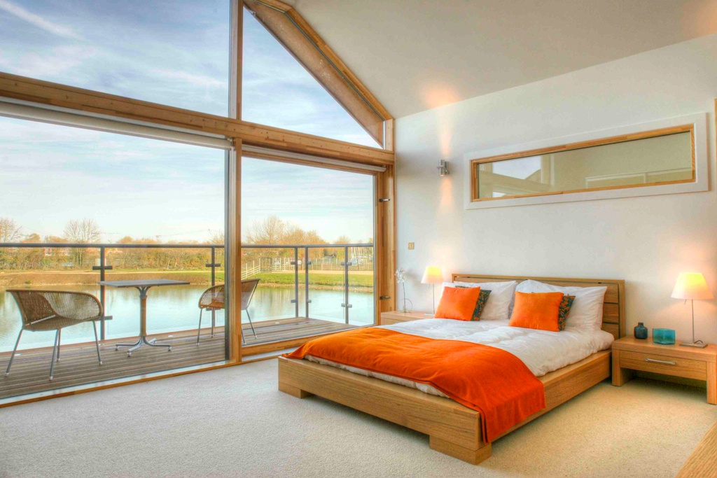 Master bedroom with terrace overlooking the lake
