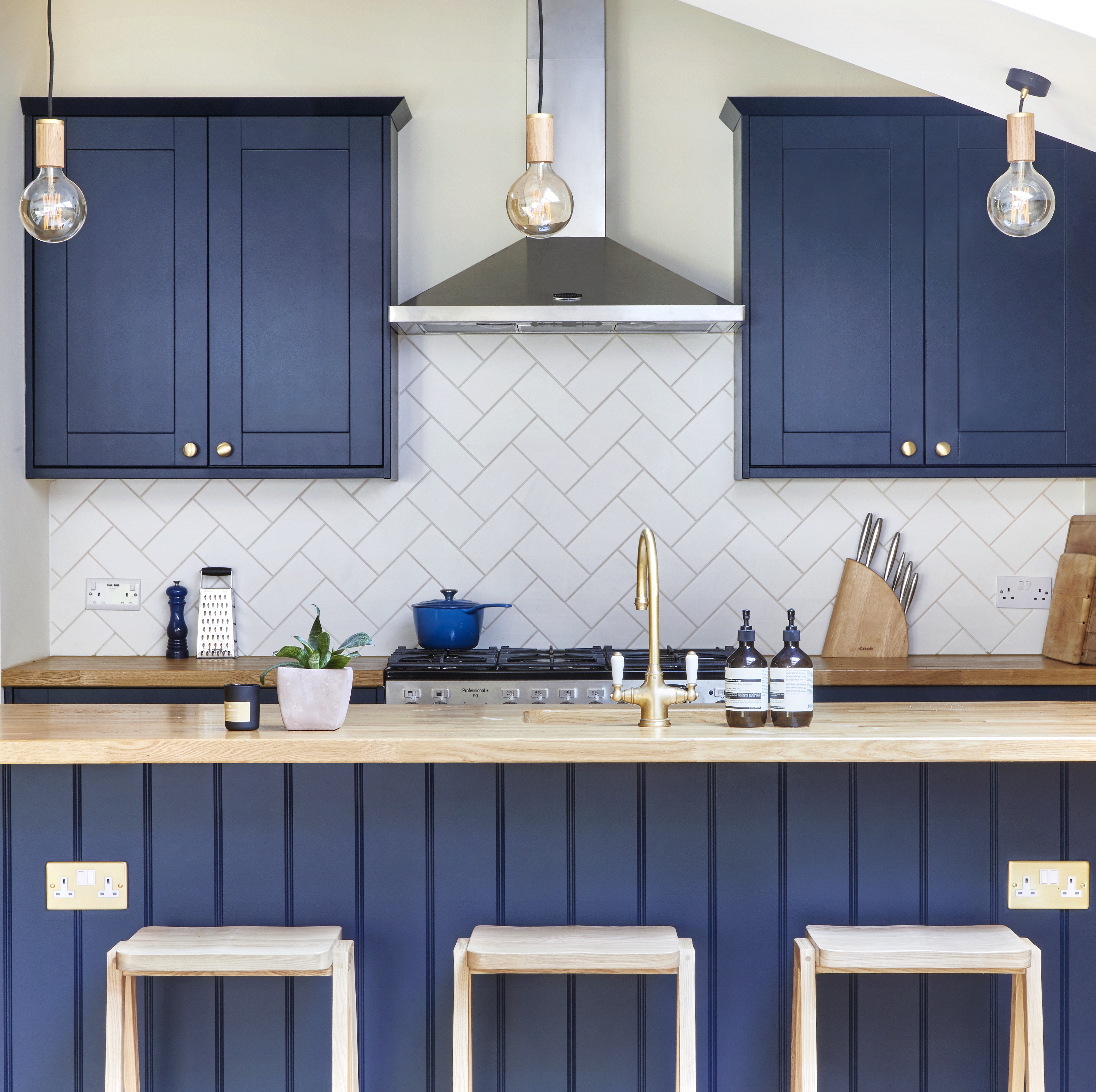 Bespoke farmhouse style kitchen with dark blue shaker cabinets made for West London client by Holland Street Kitchens.