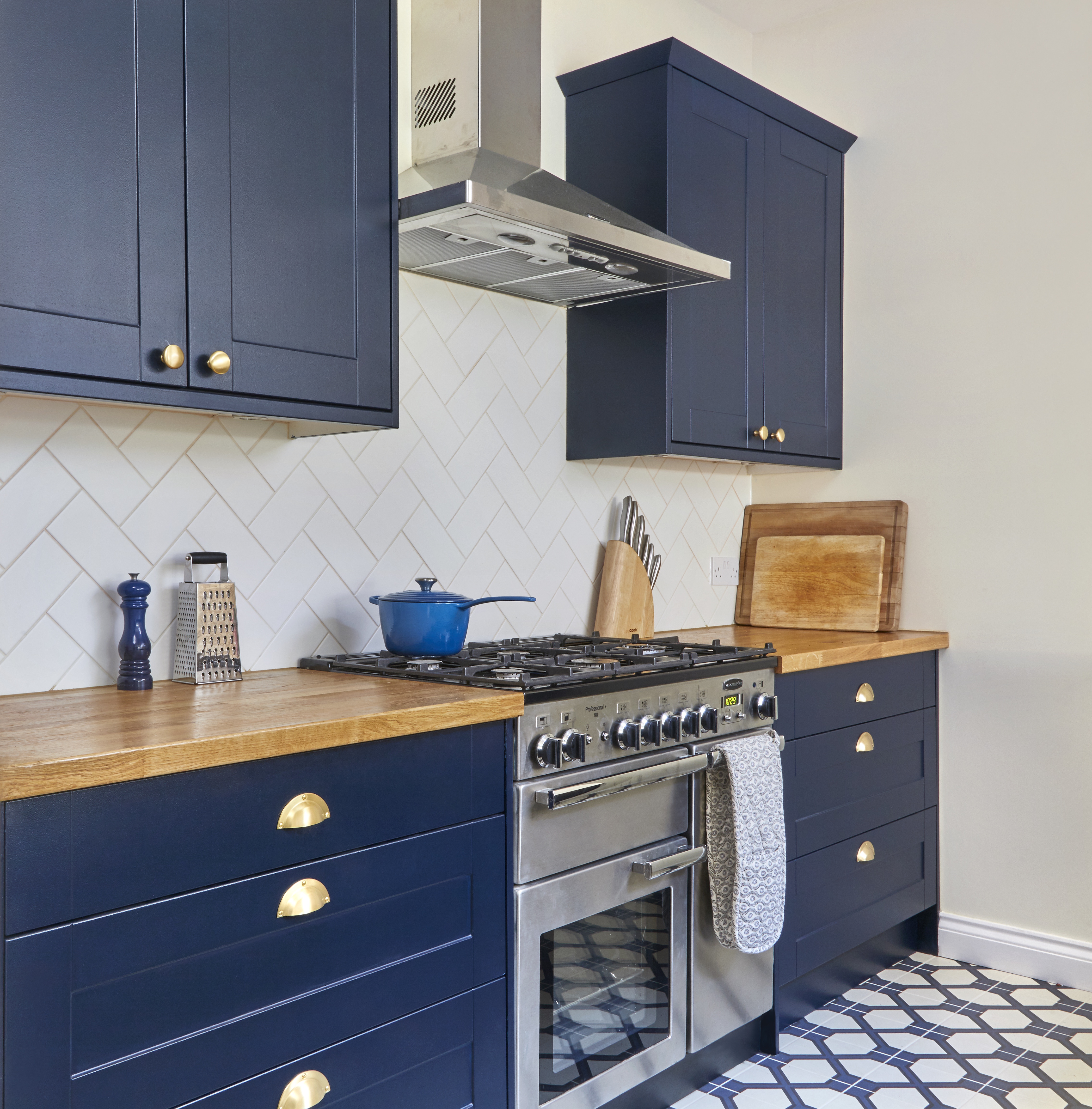 Bespoke farmhouse style kitchen with dark blue shaker cabinets made for West London client by Holland Street Kitchens.