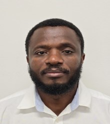 headshot of a man in a white shirt