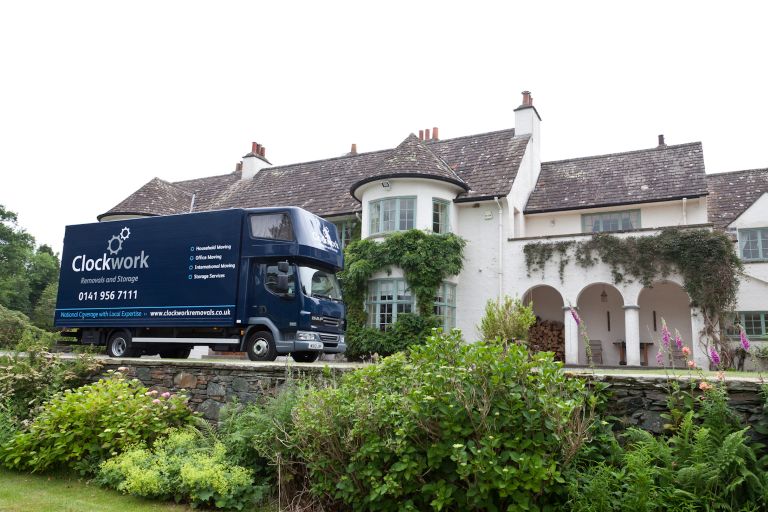 Clockwork Removals van outside a country house.