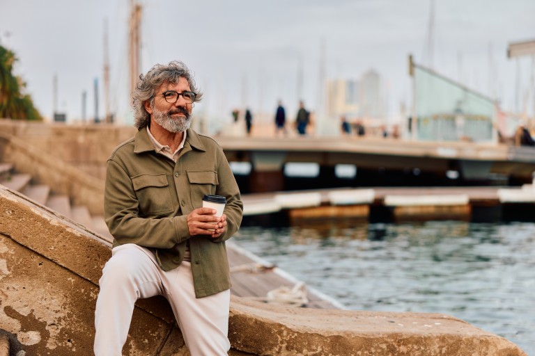 Retired man by bridge