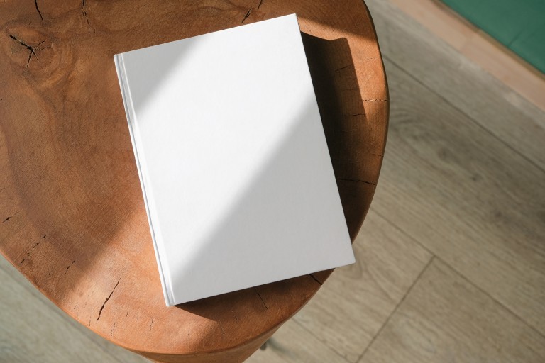 White book on wooden table