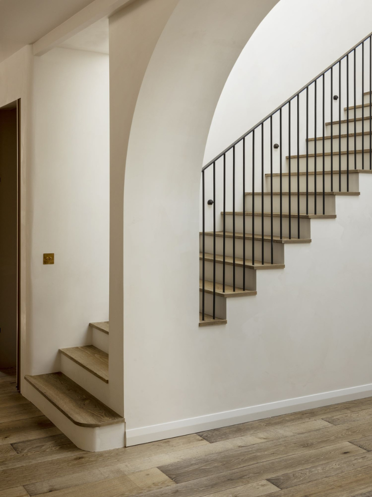 Bespoke staircase with oak treads matching the floor.